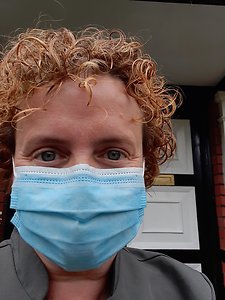 COVID-19 AND PATIENT SAFETY. Me standing outside front door with mask
